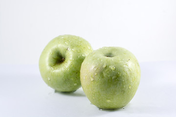 green apples on white background