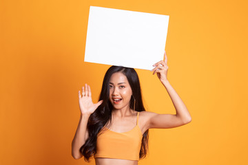 Young Asian woman surprise with white blank sign.