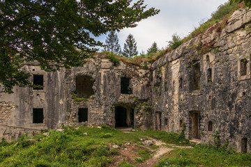 Fototapeta na wymiar Entrance Panorama of Fort Hermann. Crumbling World War I Fortress near Mount Rombon. Bovec, Gorizia, Slovenia. Europe.