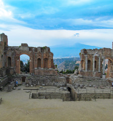 Fototapeta na wymiar Antique theater in Taormina, Sicily, Italy. Ancient ruins of amphitheater. 
