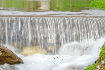 Beautiful small nature waterfall on a outdoor.