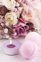 Obraz na płótnie Canvas Aroma bath bombs with pink purple bouquet