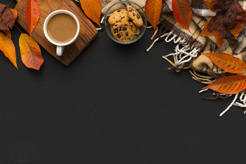 Creative autumn frame for text with coffee and fallen leaves