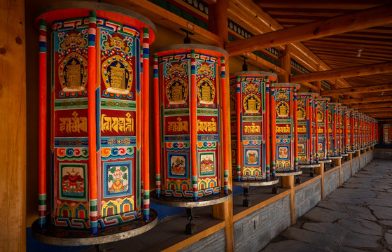Prayer wheels Xiahe, gannan autonomous Tibetan prefecture, Gansu, China. The text means om ma ni pad me hum, meaning generosity, ethics, patience, diligence, renunciation and wisdom. 