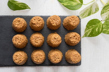 anthill cake on a black stone board, top view