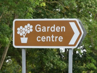 Road direction sign to garden centre in the UK