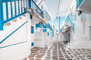Typical Greek architecture in the white, cobbled alleys of Mykonos town, houses in the old town of...