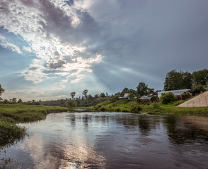 beautiful landscape of the river, blue sky with clouds, reflection of clouds and trees in water, clouds in the river, winding river, river in the field, summer, a tree near the water