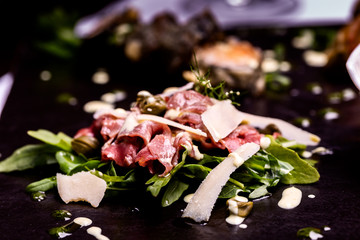 Beautiful carpaccio with cheese and vegetables.