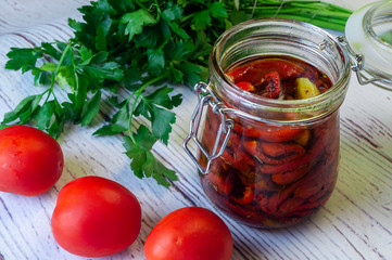 Sun dried tomatoes with olive oil in a jar