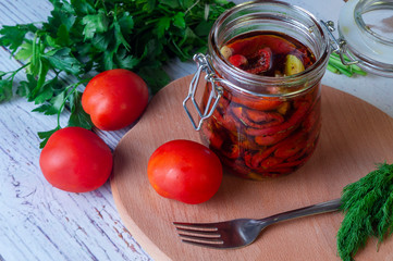 Sun dried tomatoes with olive oil in a jar