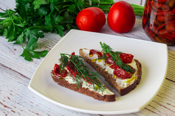 Sun dried tomatoes with olive oil in a jar