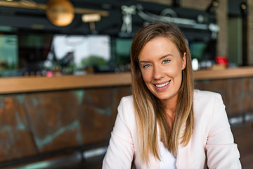 Attractive young smiling woman in smart casual wear looking at camera. Start up of enterprise, women leader the new company self-confident. Portrait of a attractive business woman