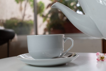 cup of coffee on wooden table