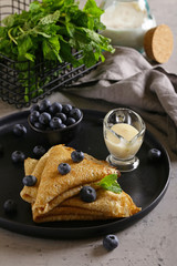 thin pancakes with blueberries for breakfast