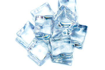 Eight wet ice cubes isolated on white background.Heap of melting ice on the plate.