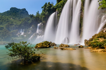 Bangioc or Detian waterfall in Cao bang, north Vietnam. These falls form the natural border between Vietnam and China. Slow shutterspeed silky smooth waterfalls.