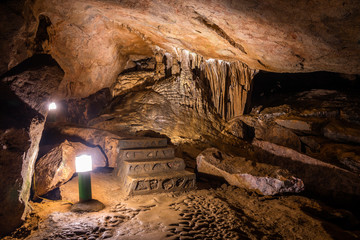 Nguom Ngao cave in North Vietnam, Cao Bang province. Walking path inside the cave. 