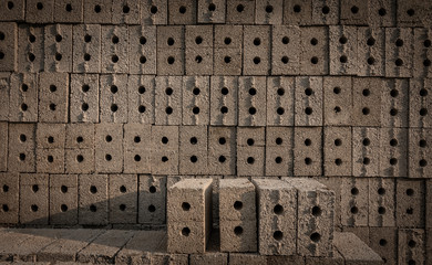 Frog bricks. Pile of cored bricks with core holes. 