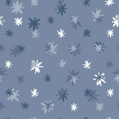 Hand drawn winter snowflakes seamless pattern. Ink stains star wallpaper on blue background. Vector illustration