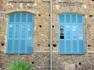 Old wall with blue windows of Jesuit Monastery in northeastern Brazil