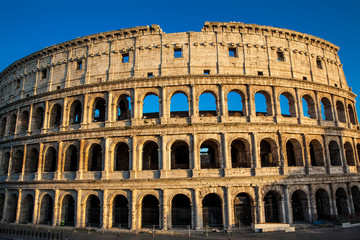 Naklejka premium The famous Colosseum under the beautiful light of the golden hour in Rome
