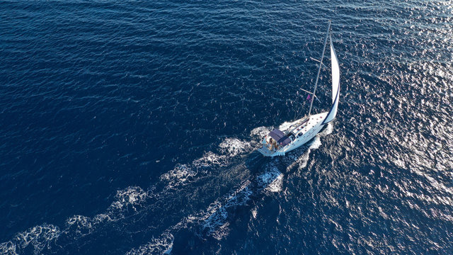 Aerial drone photo of luxury sail boat cruising in the deep blue Aegean sea, Greece © aerial-drone