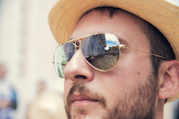 Self-portrait of Enrico Tricoli, with glasses reflecting the streets of Trinidad in Cuba.