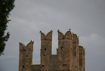 Detail of an ancient italian castle with battlements