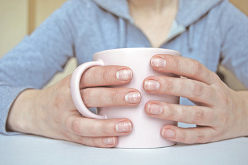 Fingernails with white dots and stripes. Leukonychia, opaque white discoloration of nails