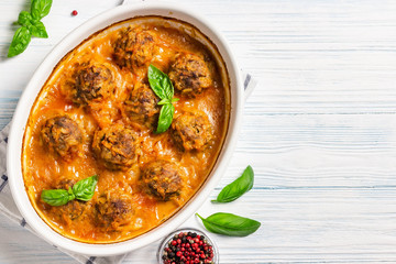 Italian baked meatballs. Top view, space for text.