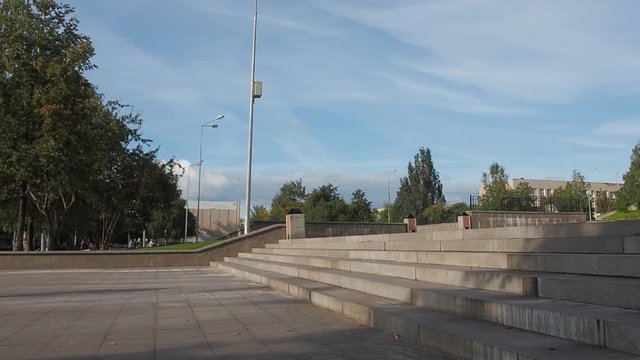 Skater doing a ollie over stairs