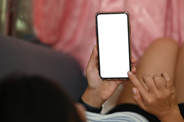 Cropped shot woman rant on sofa and holding isolated white screen smartphone.