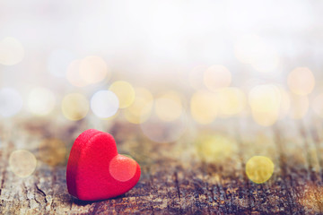 Fototapeta premium Red heart on wooden background with bokeh light effected, copy space