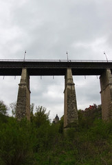 High stone supports of the old bridge in Kamenetz-Podolsk. Bottom view