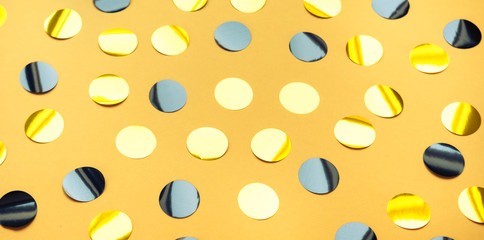 Confetti black yellow background.