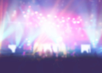 Blurred of Christian Congregation Worship God together in Big Church hall in front of music stage and light effected.