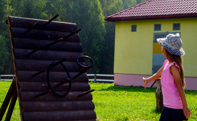 child 6-7 years old plays in the park