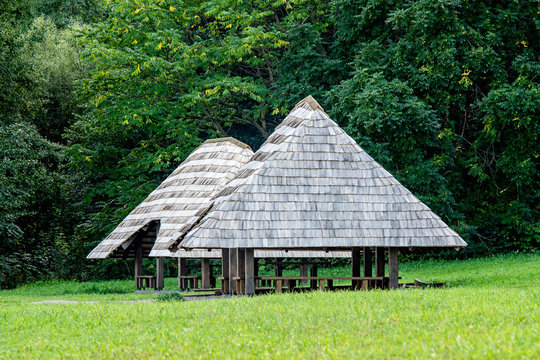 Wooden chips-covered arbor in a recreation area in the forest