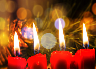 Four Red Candle on the table in Christmas night with bokeh light effected