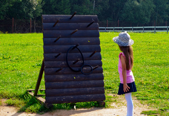 child 6-7 years old plays in the park