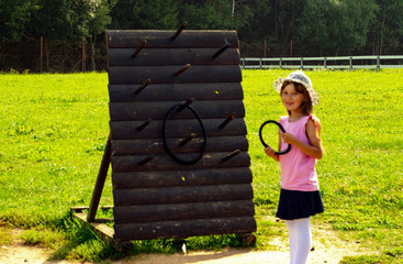 child 6-7 years old plays in the park