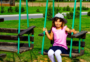 child 6-7 years old plays in the park