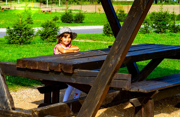 child 6-7 years old plays in the park
