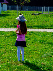 child 6-7 years old plays in the park