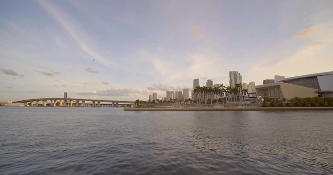 Miami stock video panning from Biscayne Bay to American Airlines Arene sunset over city 4k 60p