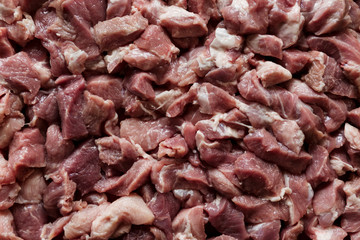 Heap of raw diced beef meat isolated, top view