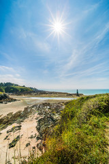 Pléneuf-Val-André Lighthouse with Turquoise Blue Atlamtic Ocean on a Sunny Summer Day in Brittany France