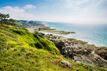 Pléneuf-Val-André Lighthouse with Turquoise Blue Atlamtic Ocean on a Sunny Summer Day in Brittany France