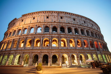 Naklejka na ściany i meble The Colosseum at night. Rome fantastic city, a historical monument